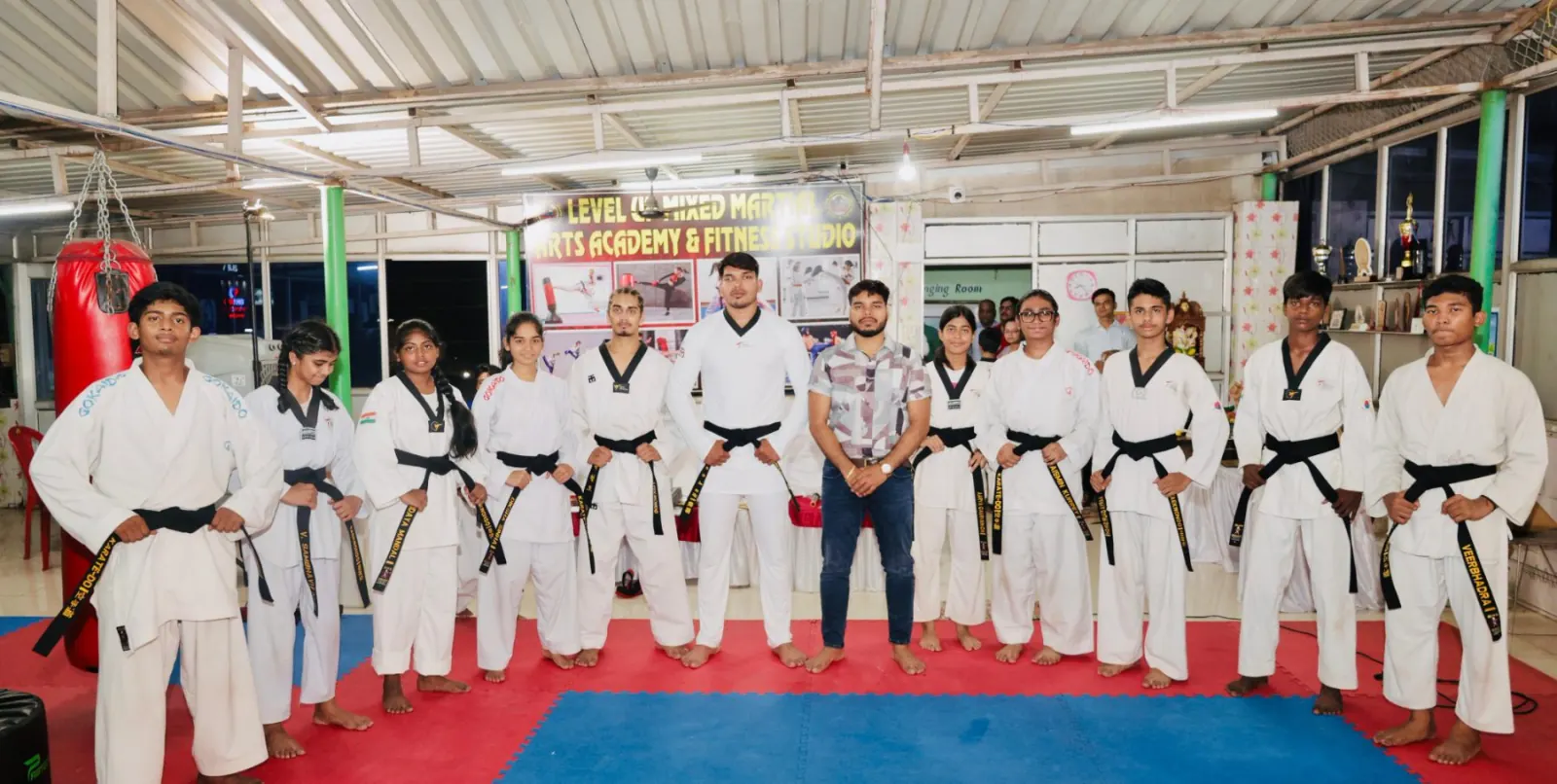Black-belt team and guests at the academy