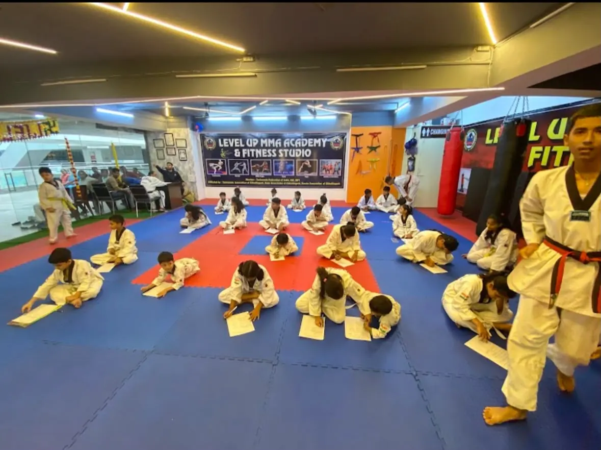 Junior class stretching on the mat